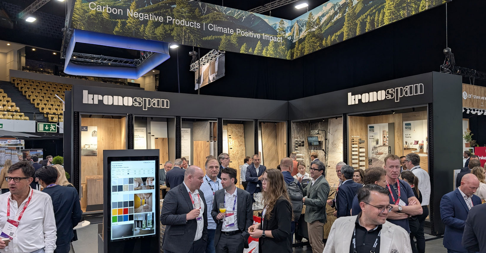 Kronospan's booth was designed to offer a hands-on experience, allowing guests to touch, test, and interact with product samples in a well-curated environment. 